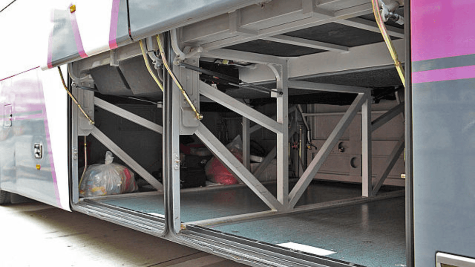 An empty bus luggage compartment