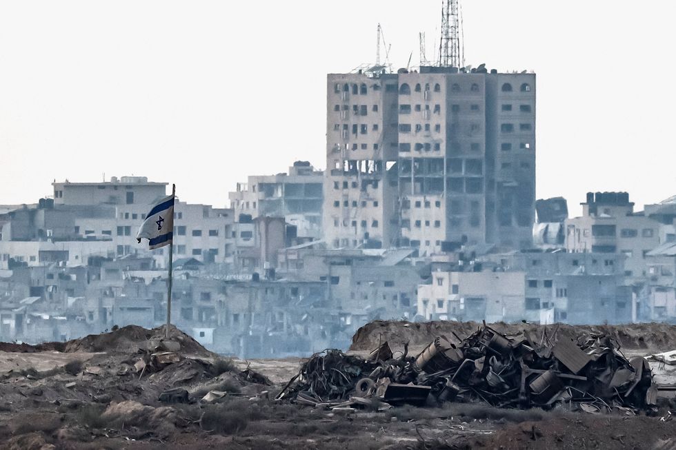 An Israeli flag flies over Gaza