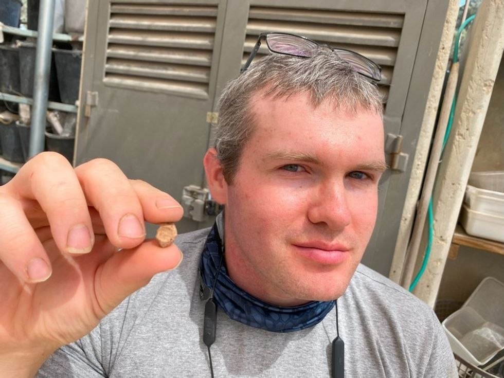 Archaeologist Mordechai Ehrlich holds the seal