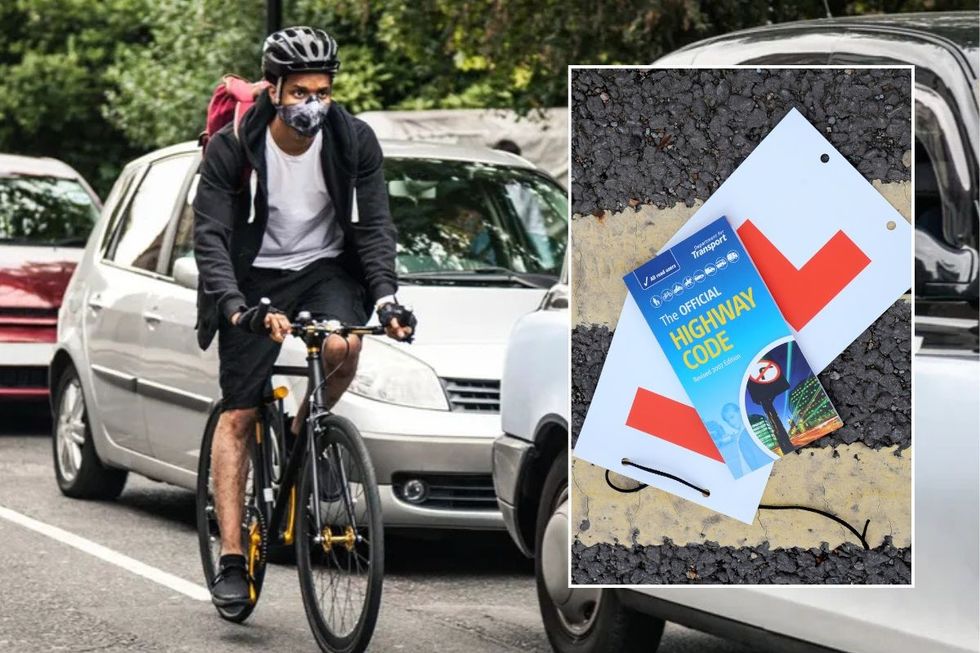 Cyclist on the road and a copy of the Highway Code