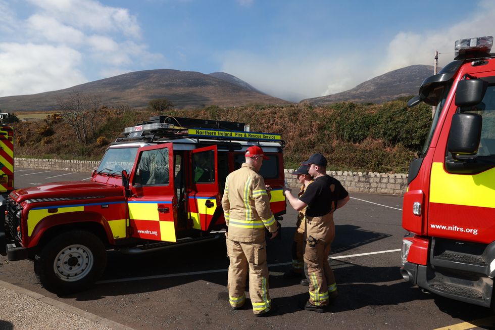 Firefighters from Northern Ireland Fire and Rescue Service (NIFRS) at Bloody Bridge car Park, Newcastle in Co Down