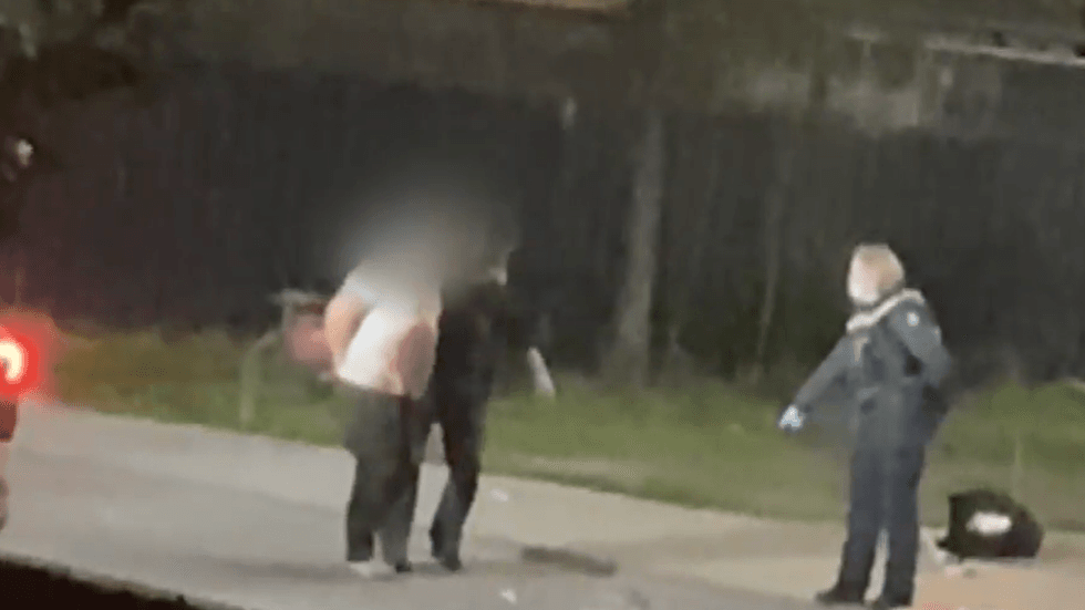 Footage of the arrest shows a man thought to be the suspect wearing a blood-stained white T-shirt