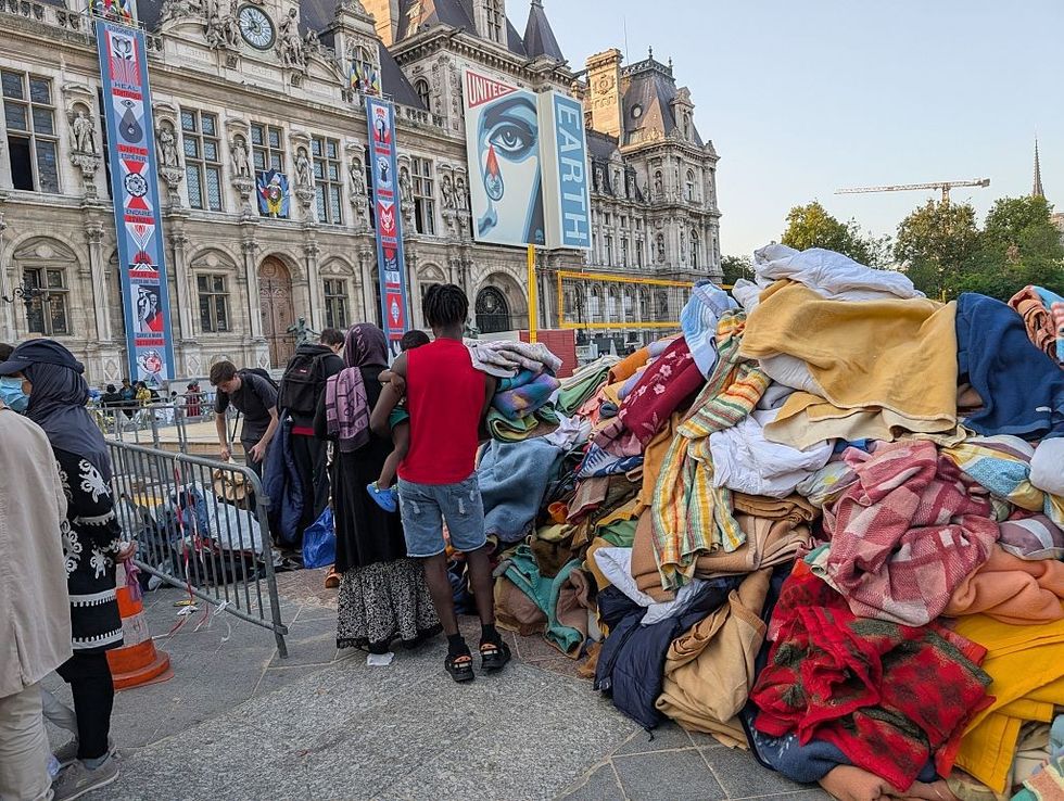 French police evacuate a 300-person migrant camp set up by Utopia 56 association