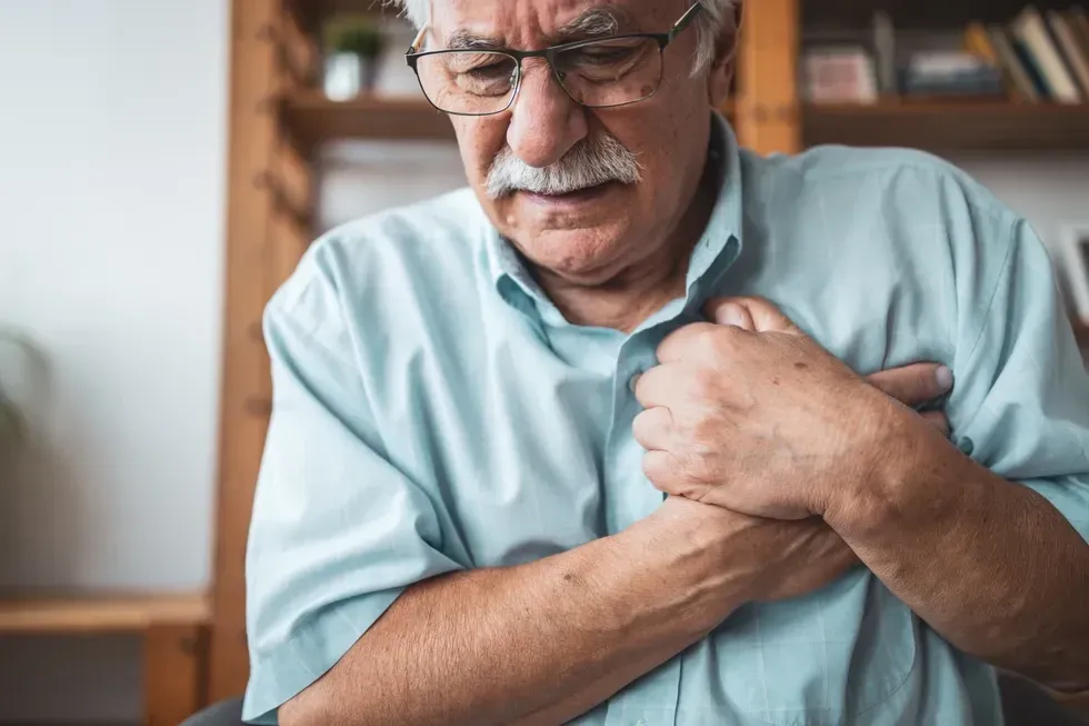 man experiencing chest pain
