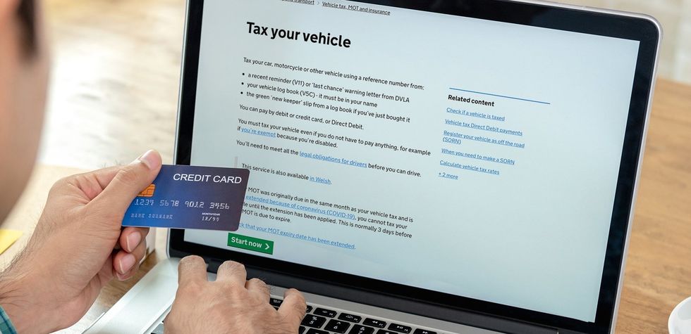 Man taxing his car