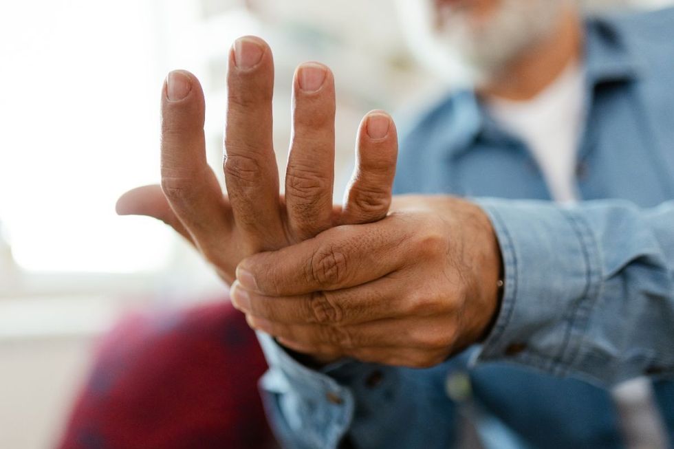 man with hand pain