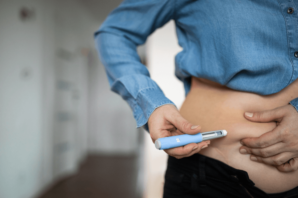Person using a weight loss injection