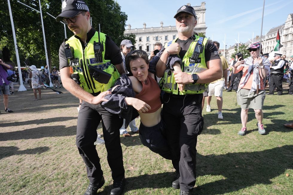 Police dragging person away