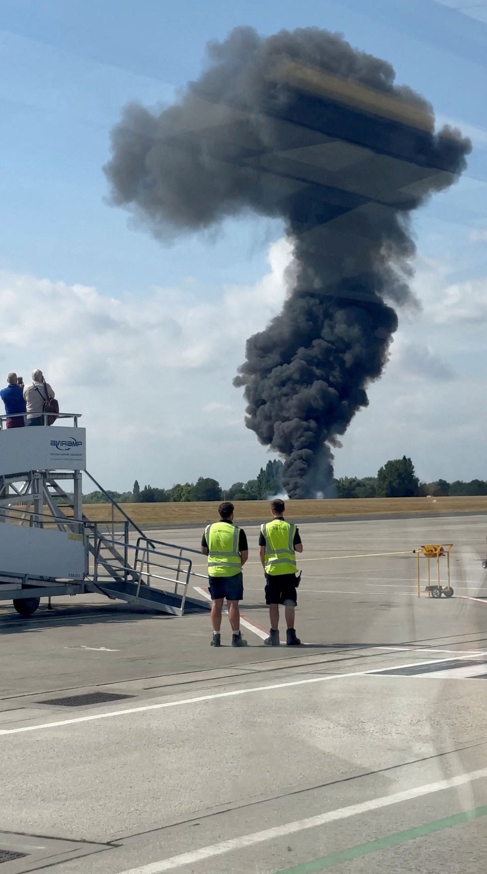 Smoke billows over Southend Airport after a small plane crash on July 13