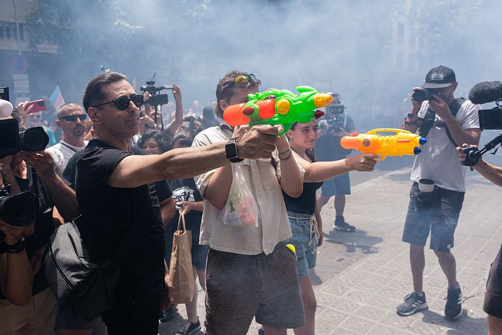 Some protestors in Barcelona sprayed tourists with water guns