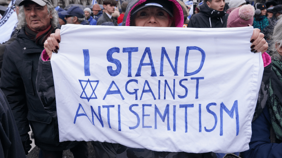 Someone protesting against antisemitism