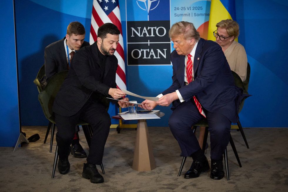 \u200b\u200bonald Trump and Ukraine's President Volodymyr Zelenskiy attend a meetin