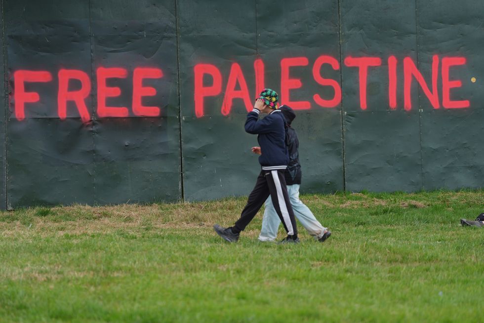 \u200bFree Palestine graffiti on a fence near the Pyramid Stage, on the first day of the Glastonbury Festival