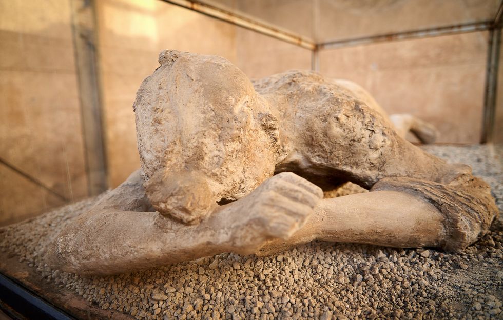 Woman covered in ash