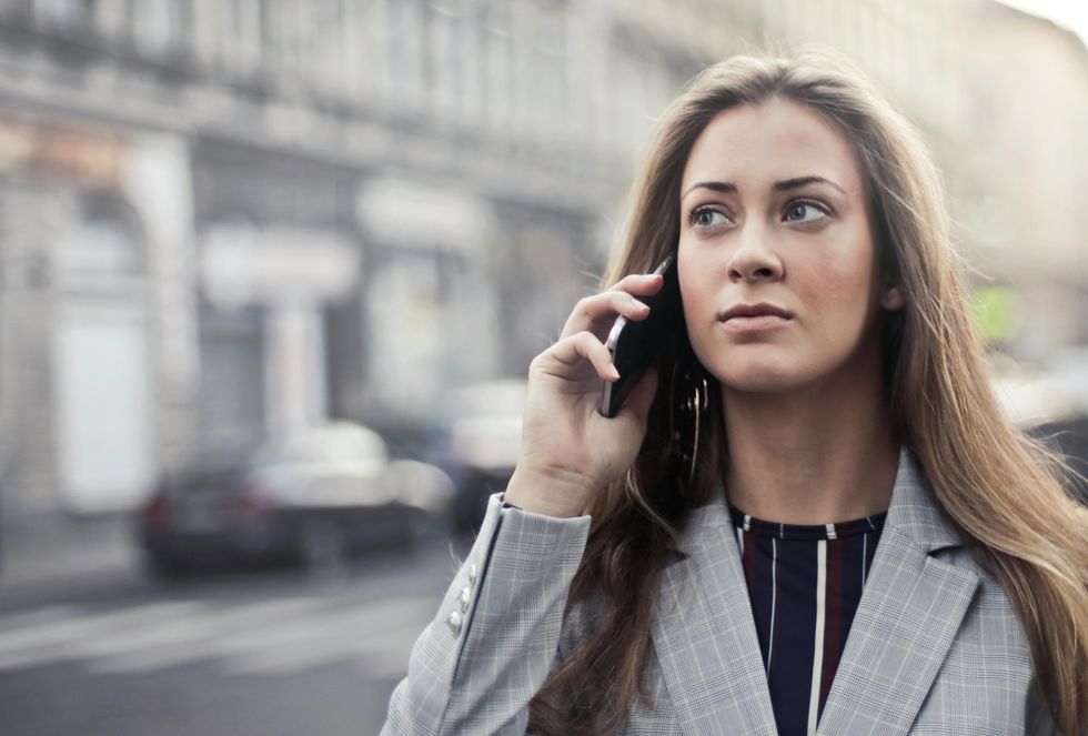 Woman holding phone to ear