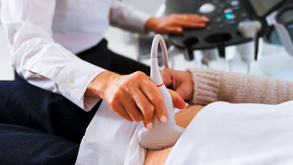 WOMAN UNDERGOING SCAN