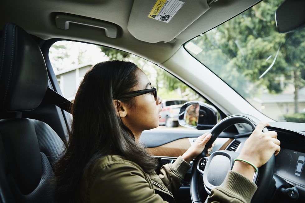 Young driver in vehicle